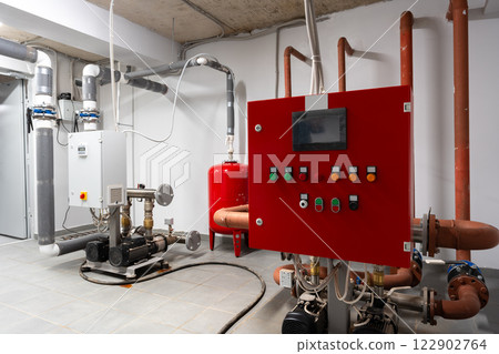 Industrial control room with piping and equipment for managing fluid systems in a commercial facility 122902764