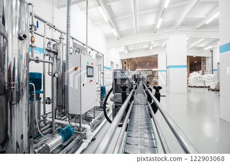 Industrial processing facility featuring automated equipment and a clean production line 122903068