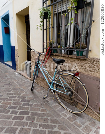 Vintage bicycle near old house Vintage bicycle near old house 122903080