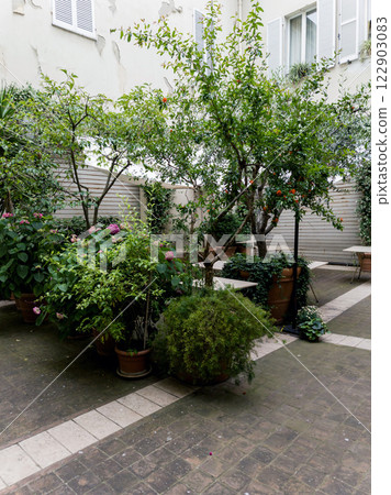 Cozy outdoor cafe with tables Cozy outdoor cafe with tables 122903083