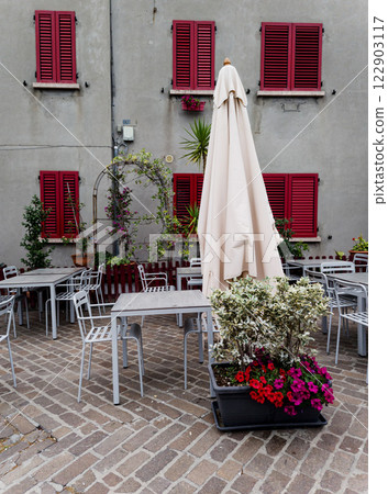 Tables and chairs in outdoor cafe Tables and chairs in outdoor cafe 122903117