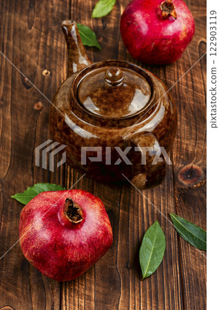 Hot fruit pomegranate tea in teapot. Hot fruit pomegranate tea in teapot. 122903119