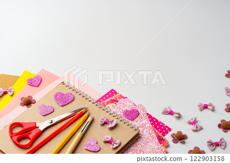Crafting supplies and materials arranged for creative projects on a tabletop in a bright and inviting workspace Crafting supplies and materials arranged for creative projects on a tabletop in a bright and inviting workspace 122903158