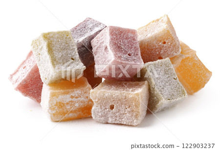 A vibrant assortment of Turkish delight cubes rests on a smooth surface, featuring a range of flavors including orange, rose, and lemon A vibrant assortment of Turkish delight cubes rests on a smooth surface, featuring a range of flavors including orange, rose, and lemon 122903237