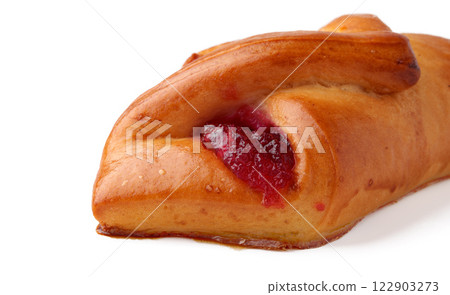 Freshly baked pastry filled with fruit jam showcases delightful flavors and texture 122903273