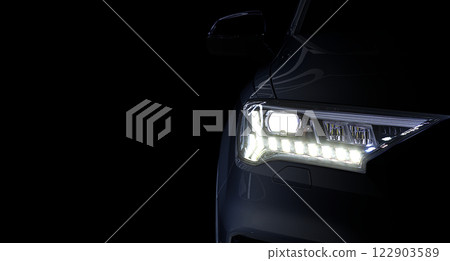 Close-up front headlight with LED xenon light of grey modern EV Car on black color background Close-up front headlight with LED xenon light of grey modern EV Car on black color background 122903589