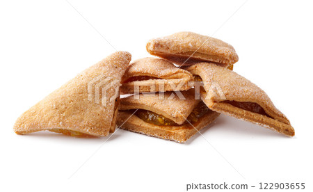Delicious baked pastries filled with sweet fruit preserves stacked on a white surface Delicious baked pastries filled with sweet fruit preserves stacked on a white surface 122903655