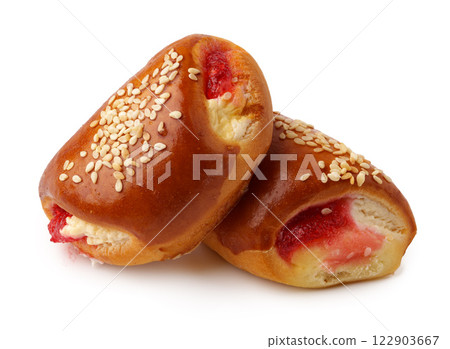 Delicious pastry rolls filled with sweet strawberry and topped with sesame seeds 122903667