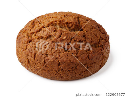 Freshly baked round ginger cookie displayed against a simple background 122903677