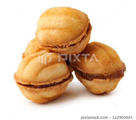 Delicious homemade nut-shaped cookies filled with sweet caramel in a simple presentation 122903681