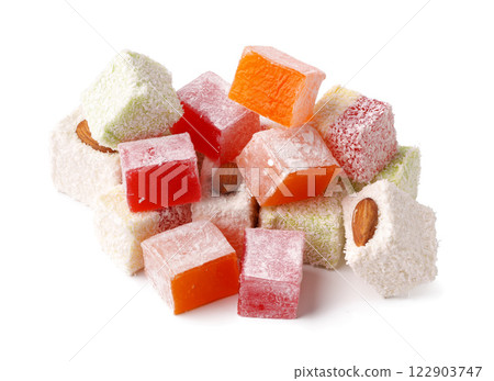 Colorful assortment of Turkish delight with nuts and powdered sugar arranged on a white background Colorful assortment of Turkish delight with nuts and powdered sugar arranged on a white background 122903747