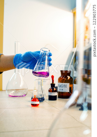 Laboratory experiment involving colorful chemical reactions in a research setting during a daytime session Laboratory experiment involving colorful chemical reactions in a research setting during a daytime session 122903775