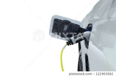 Close-up EV plug connected white modern EV Car for recharging battery energy, green energy on zero emission 122903892