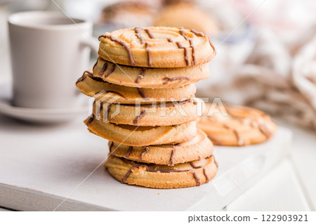 Sweet chocolate cookies on white table. 122903921
