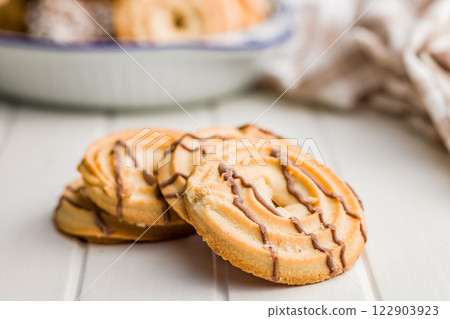 Sweet chocolate cookies on white table. Sweet chocolate cookies on white table. 122903923