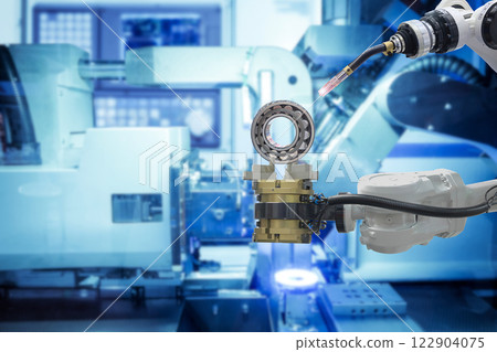Close-up industrial welding robotics working with metalwork from gripping robot on smart factory Close-up industrial welding robotics working with metalwork from gripping robot on smart factory 122904075