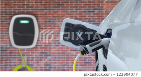 Close-up EV plug connected white modern EV Car for recharging battery energy from electric charge machine Close-up EV plug connected white modern EV Car for recharging battery energy from electric charge machine 122904077
