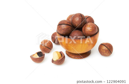 Macadamia nuts in bowl on a white Macadamia nuts in bowl on a white 122904091