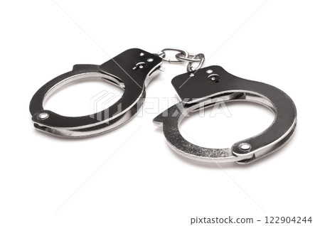 Handcuffs isolated on a white 122904244
