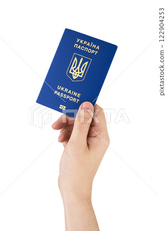 Passport of Ukraine in hand isolated on white Passport of Ukraine in hand isolated on white 122904253