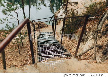 Metal staircase on a mountain path. Hiking in the mountains. Tourist Path in High Mountains 122904346