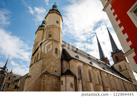Scenic view Marktkirche Market Church of Our Dear Lady at Halle on Saale in Saxony-Anhalt Germany against sunny blue sky . Medieval historical architecture tourism travel destination Scenic view Marktkirche Market Church of Our Dear Lady at Halle on Saale in Saxony-Anhalt Germany against sunny blue sky . Medieval historical architecture tourism travel destination 122904445