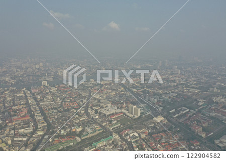 It is DUST in the Air in 2019, the Air Pollution of PM2.5 of the suburbs stretching to the big city. which was shrouded in dirty dust and the sky was wide with gigantic clouds. 122904582