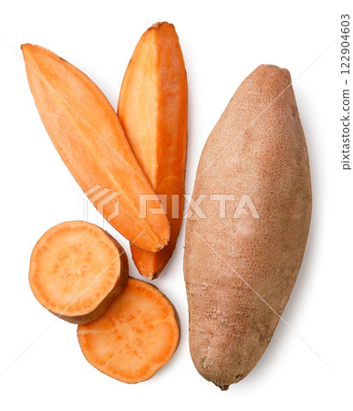 Sweet potato and sliced pieces close-up on a white. Top view Sweet potato and sliced pieces close-up on a white. Top view 122904603