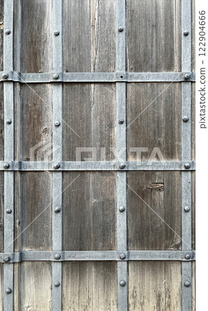 Old wooden wall with metal stripes Old wooden wall with metal stripes 122904666