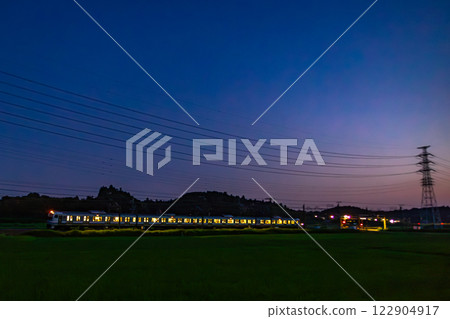 A four-car E217 series train running at dusk A four-car E217 series train running at dusk 122904917