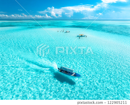 Aerial view of colorful boats, sandbank, blue sea on sunny day 122905211