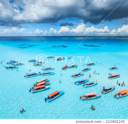 Aerial view of colorful boats, sandbank, blue sea on sunny day 122905245