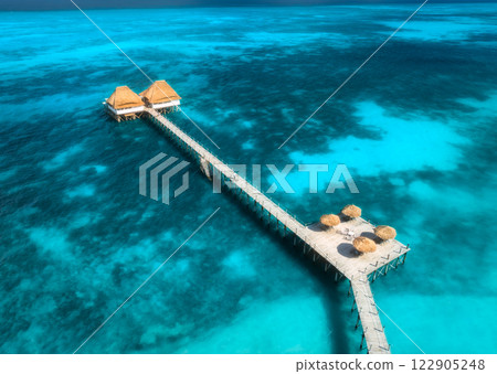 Aerial view of bungalow, jetty, blue sea on summer sunny day 122905248