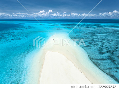 Aerial view of island, sandbank in ocean, sandy beach, blue sea Aerial view of island, sandbank in ocean, sandy beach, blue sea 122905252