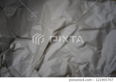 a crumpled brown wrapping paper, texture, background 122905707