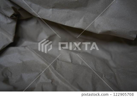 a crumpled brown wrapping paper, texture, background 122905708
