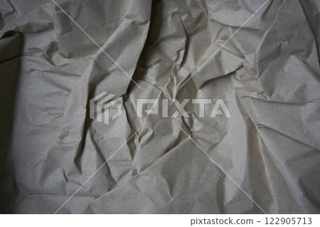a crumpled brown wrapping paper, texture, background 122905713