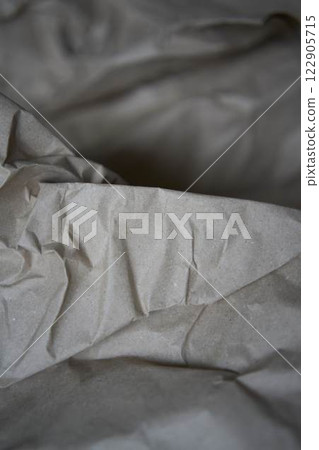 a crumpled brown wrapping paper, texture, background 122905715