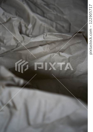 a crumpled brown wrapping paper, texture, background 122905717