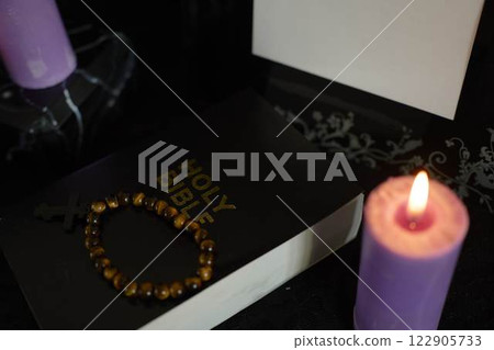 funeral, a photo frame, candles, marble urn for ashes, holy bible and spiritual bracelet with black cross funeral, a photo frame, candles, marble urn for ashes, holy bible and spiritual bracelet with black cross 122905733