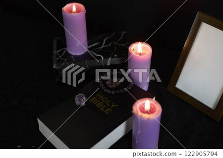 funeral, photo frame, candles, an urn for ashes, holy bible and jewelry with precious stones made from the ashes of the deceased funeral, photo frame, candles, an urn for ashes, holy bible and jewelry with precious stones made from the ashes of the deceased 122905794