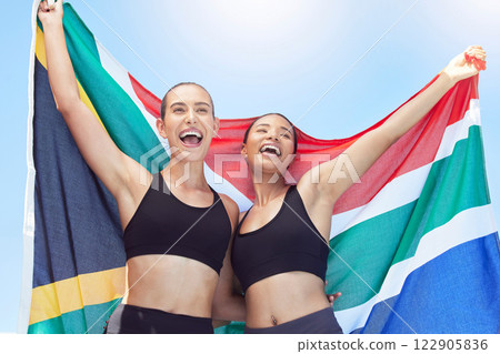 Sports women, athlete and south africa flag team winner celebration, achievement and global contest outdoor. Happy, excited and african country champion runner celebrate motivation, pride and success 122905836