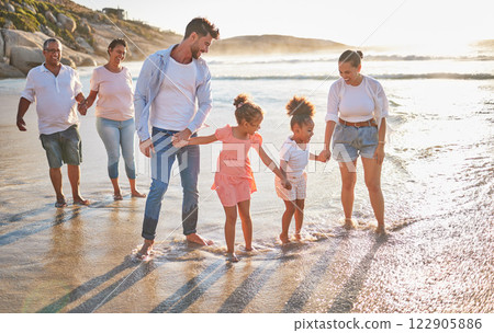 Walking family, beach travel and parents on holiday in nature of Dubai with children and grandparents during summer. Girl kids on walk by the sea with mother, father and senior people with love 122905886