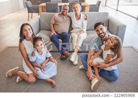Interracial family portrait, children with grandparents with love, hug and smile together. Happy elderly mother, father and kids together with adult children on the floor in the living room of house Interracial family portrait, children with grandparents with love, hug and smile together. Happy elderly mother, father and kids together with adult children on the floor in the living room of house 122905909