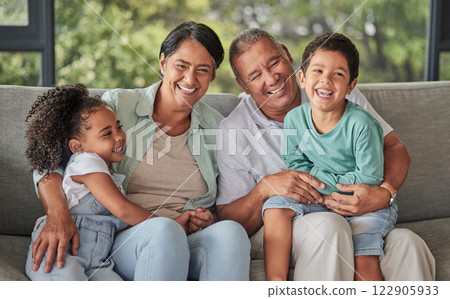 Love, happy family and children bonding with grandparents on sofa at home, laugh and having fun in their family home. Relax, play and excited kids embracing and enjoying a visit to grandparent home Love, happy family and children bonding with grandparents on sofa at home, laugh and having fun in their family home. Relax, play and excited kids embracing and enjoying a visit to grandparent home 122905933