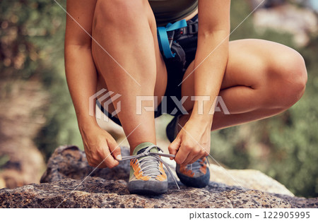 Outdoor runner, tie fitness shoes and sports woman start cardio workout in los angeles forest. Athlete ready to exercise, training for trail running distance and active healthy lifestyle 122905995