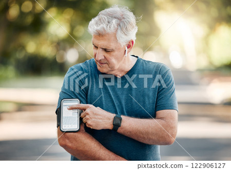 Senior man, phone band and fitness with music earphones in nature park, environment or Australian garden. Mature runner with 5g mobile technology for radio playlist, exercise training and workout app 122906127