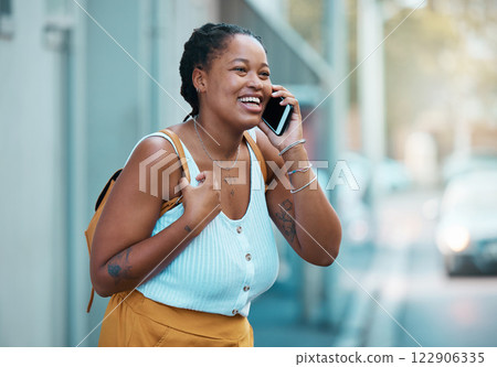 Black woman, phone and happy in city on call outdoor while laughing in street. Plus size woman, smartphone and walking in road, smile and real excited to talk on cellphone on travel to San Francisco 122906335