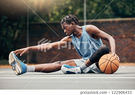 Man, basketball and training do stretching, exercise or prepare on court with sportswear. Black man, sport and ball before practice match or game in urban park for sports, fitness and physical health 122906433