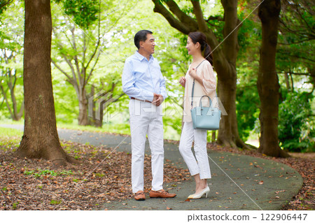 Senior couple smiling outdoors Senior couple smiling outdoors 122906447
